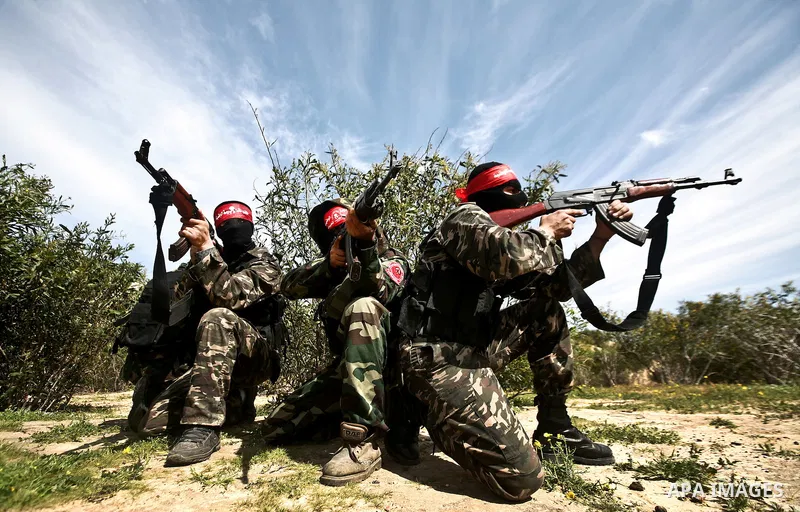 Palestinian militants of the Democratic Front for the Liberation of Palestine (DFLP) take part in a training exercise in front of the media in Rafah in the southern Gaza Strip, Mar. 08, 2012. Photo by Ali Jadallah
