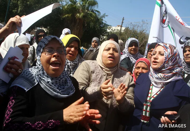 A Palestinian woman hold a poster during a protest calling for the release of Hana Shalabi, a female Palestinian prisoner jailed in Israel who has been on hunger strike for 22 days, outside the Red Cross building in Gaza...