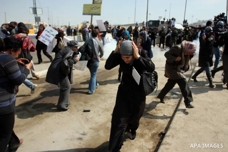 Palestinian women take part in a rally to mark International Women's Day and to show their solidarity with female Palestinian detainee Hana Shalabi, who is on hunger strike, at Qalandia checkpoint near the West Bank city...