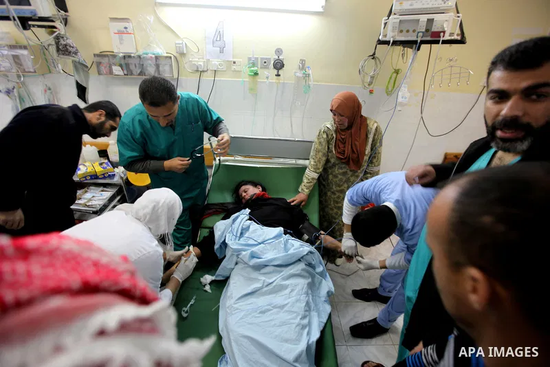 The mother of Zacharia Abu Aram lies unconscious in the hospital after she was wounded when Israeli soldiers opened fire in response to her son stabbing a soldier in the village of Yatta, south of the West Bank town of H...