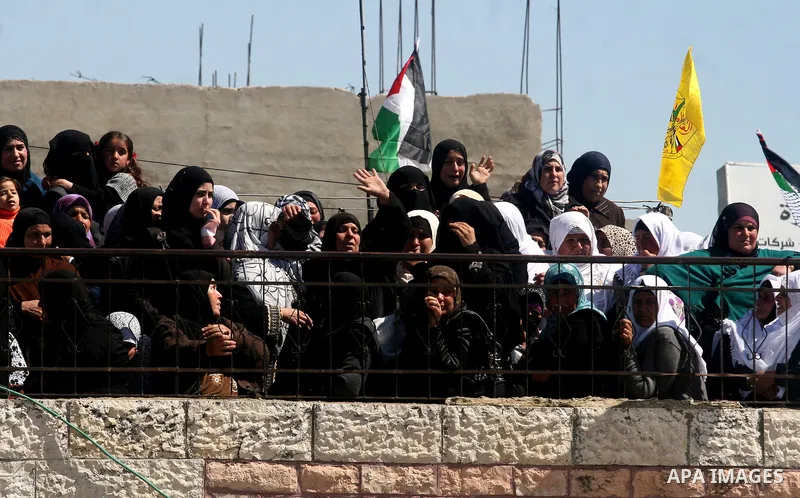 Palestinians women react during the funeral of Zakariya Abu Eram in the West Bank town of Yatta, near Hebron, Friday, March 9, 2012. According to the Israeli military, a Palestinian stabbed an Israeli soldier in the neck...