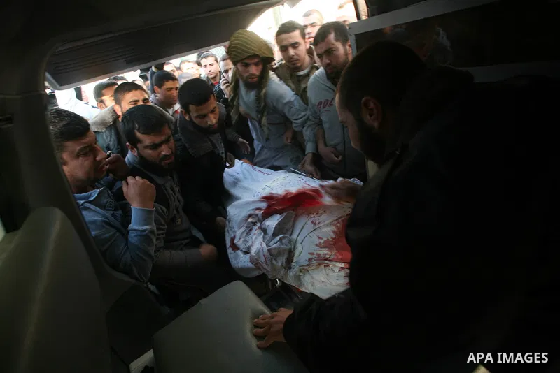 Palestinian carry the body of Zuhair al-Qaissi, a commanderl of the armed wing of the Popular Resistance Committees (PRC) in Gaza City, Friday, March 9, 2012. An Israeli airstrike killed top Palestinian militant commande...