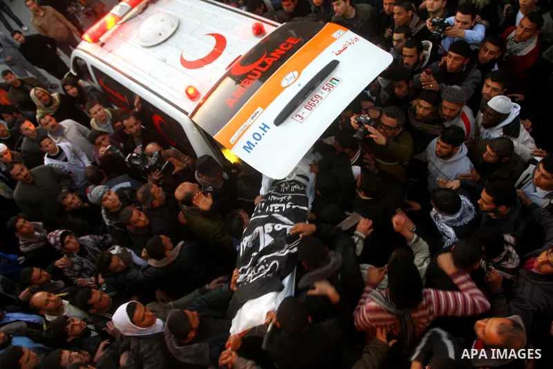 Palestinian carry the body of Zuhair al-Qaissi, a commander of the armed wing of the Popular Resistance Committees (PRC) in Gaza City, Friday, March 9, 2012. An Israeli airstrike killed top Palestinian militant commander...