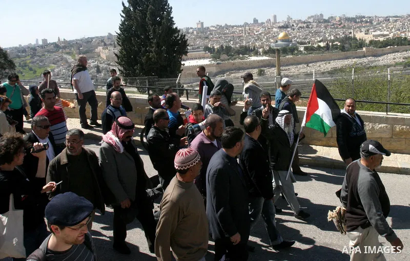 Palestinian protesters demonstrate near the Dome of the Rock in the Al-Aqsa mosque compound against a decision by the Jerusalem municipality and Israel's Nature and Parks Authority (NPA) to build a national park on Pales...