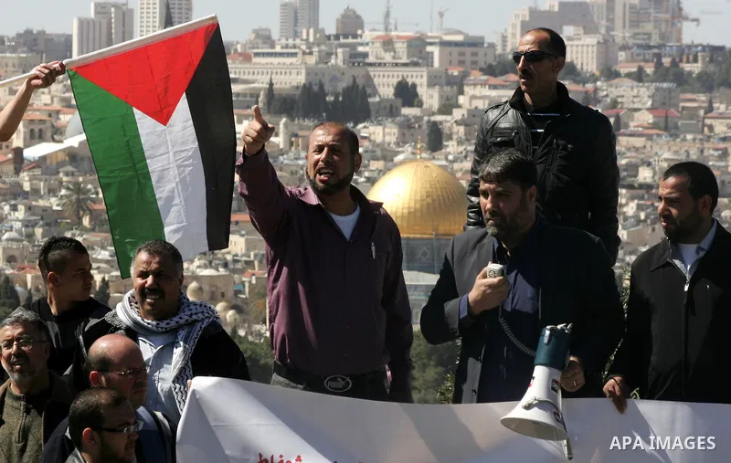 Palestinian protesters demonstrate near the Dome of the Rock in the Al-Aqsa mosque compound against a decision by the Jerusalem municipality and Israel's Nature and Parks Authority (NPA) to build a national park on Pales...