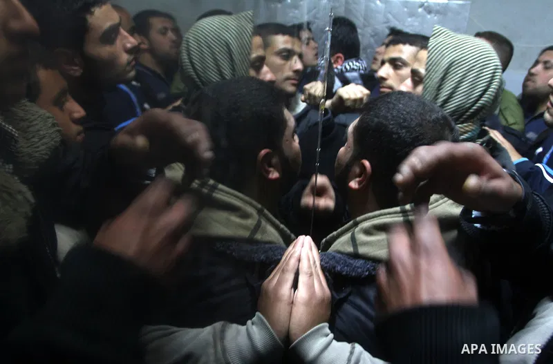 Relatives of a man killed in an Israeli airstrike mourn at a morgue in Gaza City, Friday, March 9, 2012. The Israeli military said in a statement that it targeted two rocket launching positions in the Gaza Strip Friday....