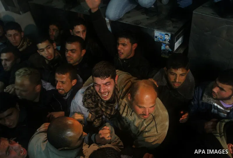 Relatives of a man killed in an Israeli airstrike mourn at a morgue in Gaza City, Friday, March 9, 2012. The Israeli military said in a statement that it targeted two rocket launching positions in the Gaza Strip Friday....