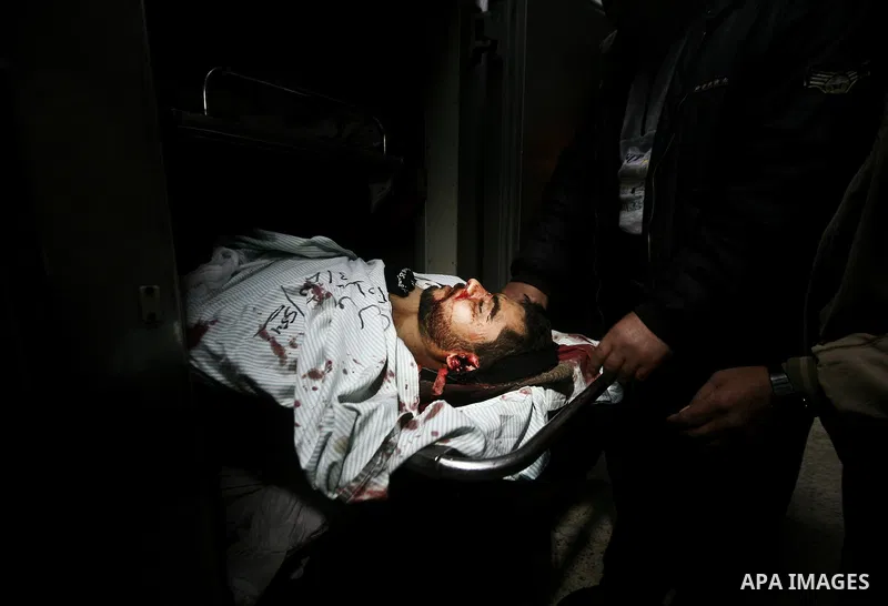 Palestinian mourn over the body islamic Jehad militant Hazem Kerekeaa in the al-Shifa hospital morgue on March 9, 2012, bringing the number of Palestinians killed in a day of cross-boarder fighting to four after a second...