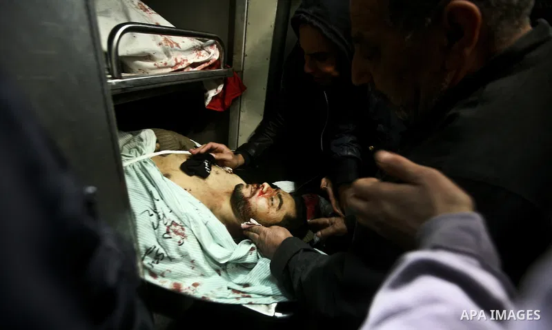 Palestinian mourn over the body islamic Jehad militant Hazem Kerekeaa in the al-Shifa hospital morgue on March 9, 2012, bringing the number of Palestinians killed in a day of cross-boarder fighting to four after a second...