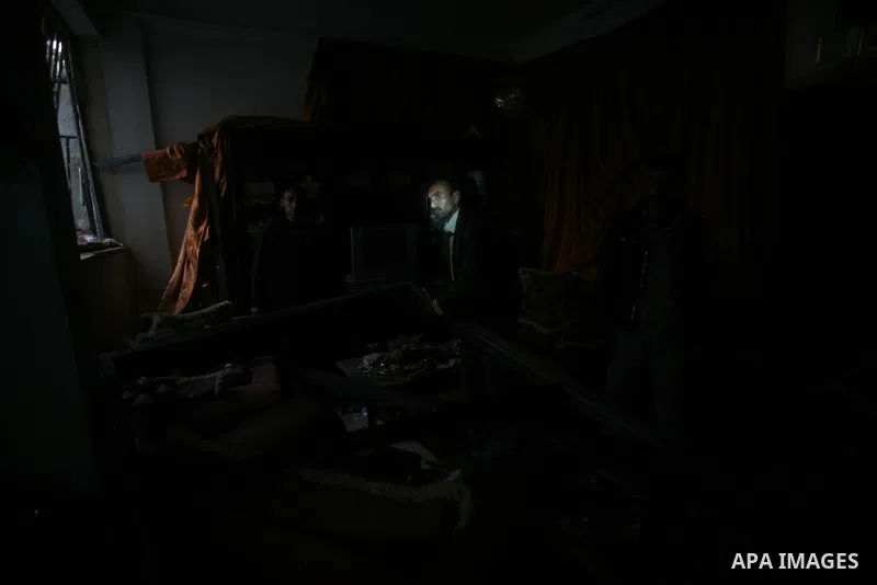 Palestinians inspect damage in their house in Al Shijaia Neighborhood in Gaza city, after an Israeli air strike in Gaza City on 10 March 2012, bringing the number of Palestinians killed in a day of cross-border fighting...