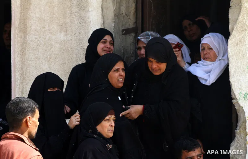 Palestinian relatives of Islamic Jihad militant Ahmed Hajaj mourns during his funeral in Gaza March 10, 2012. Israel killed two more Gaza militants on Saturday, raising the death toll in two days of violence to 12 and do...