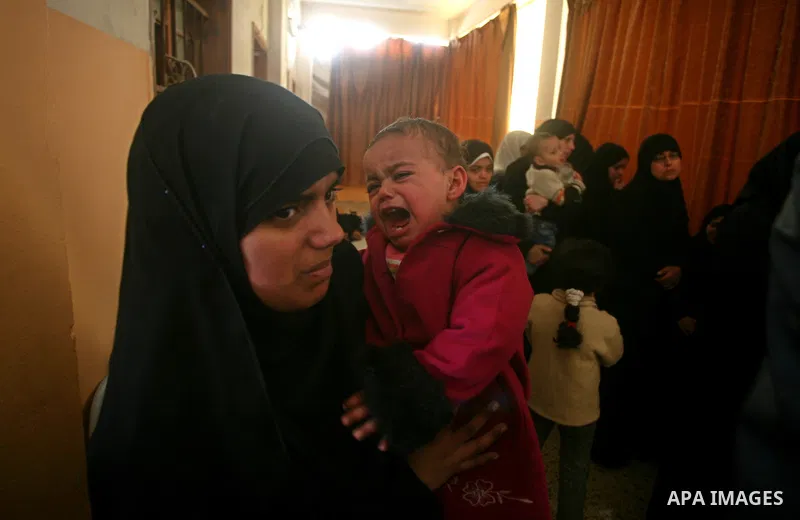 Palestinian relatives of Islamic Jihad militant Ahmed Hajaj mourns during his funeral in Gaza March 10, 2012. Israel killed two more Gaza militants on Saturday, raising the death toll in two days of violence to 12 and do...