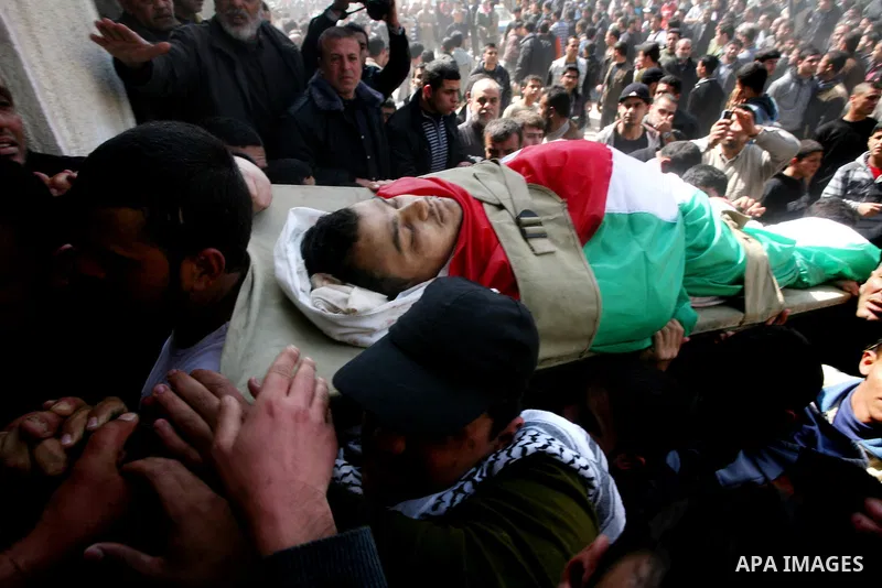 Palestinians carry the bodies of Islamic Jihad militants during their funeral in Gaza March 10, 2012. Israel killed two more Gaza militants on Saturday, raising the death toll in two days of violence to 12 and dozens of...