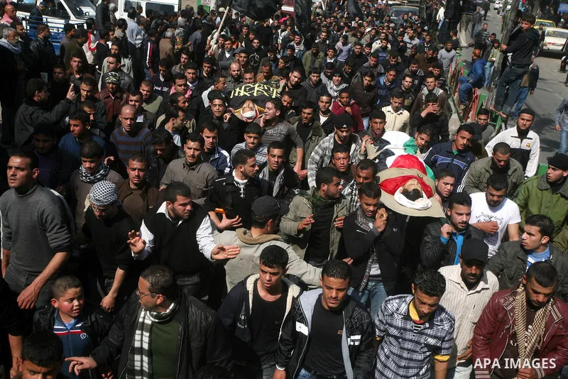 Palestinian mourners carry the bodies of seven Islamic Jihad militants (not all seen in picture), who were killed in Israeli air strikes, during their funeral in Gaza City on March 10, 2012. Twelve Palestinian fighters w...
