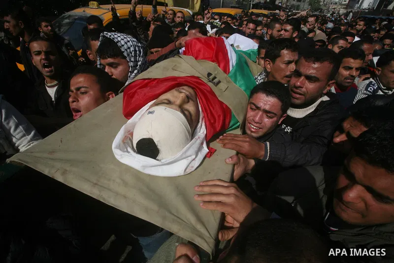 Palestinian mourners carry the bodies of seven Islamic Jihad militants (not all seen in picture), who were killed in Israeli air strikes, during their funeral in Gaza City on March 10, 2012. Twelve Palestinian fighters w...
