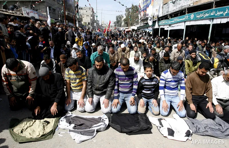 Palestinians pray in the Masjid Alawdh during the funeral of the Secretary-General of the Popular Resistance Committees, Zuhair al-Qaisi, after he was killed in an Israeli air strike on a car traveling in Rafah. Fourteen...