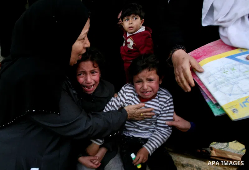 Palestinians women react during the funeral of 12 year old Ayoub Assalya killed in an Israeli airstrike in Jabaliya Refugee Camp, Gaza Strip Sunday, March 11, 2012. The worst round of violence in more than a year between...