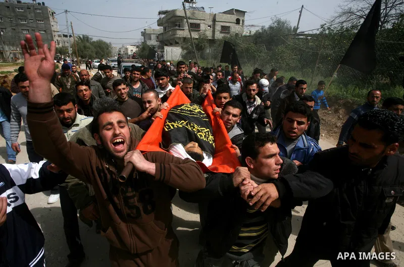 Palestinians carry the body of a 12 year old Ayoub Assalya during his funeral in Jabaliya Refugee Camp, Gaza Strip Sunday, March 11, 2012. The worst round of violence in more than a year between Israel and Gaza Strip Pal...