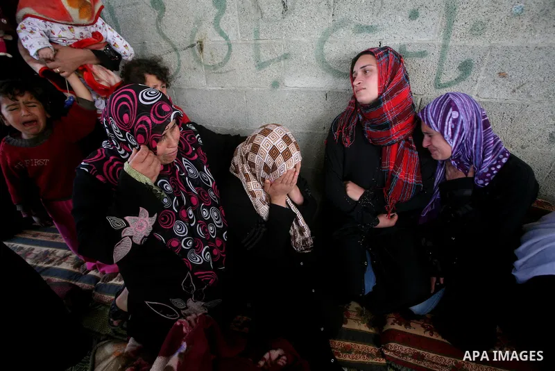 Palestinians women react during the funeral of 12 year old Ayoub Assalya killed in an Israeli airstrike in Jabaliya Refugee Camp, Gaza Strip Sunday, March 11, 2012. The worst round of violence in more than a year between...