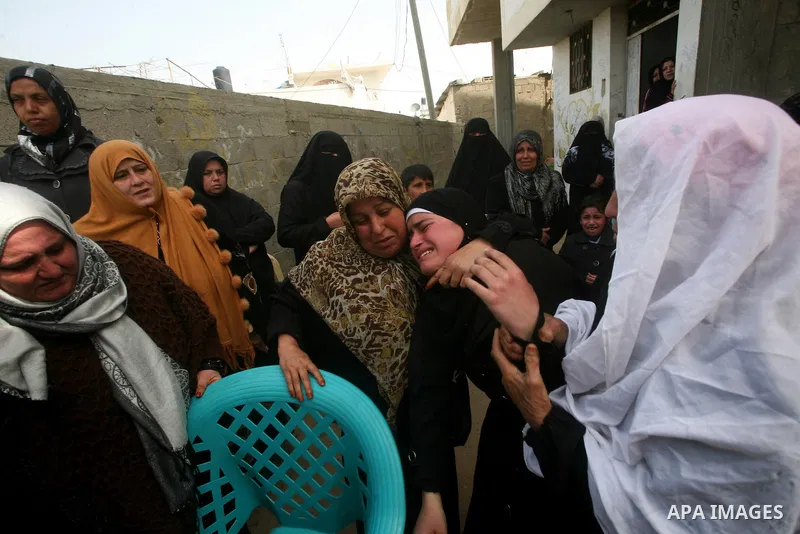 Palestinians women react during the funeral of 12 year old Ayoub Assalya killed in an Israeli airstrike in Jabaliya Refugee Camp, Gaza Strip Sunday, March 11, 2012. The worst round of violence in more than a year between...