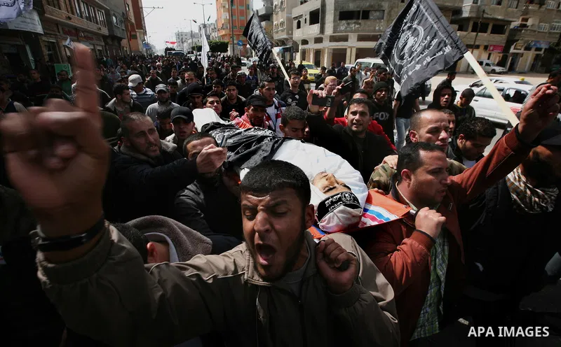 Palestinians carry the body of Ahmed Salim during his funeral in Gaza Strip Sunday, March 11, 2012. The worst round of violence in more than a year between Israel and Gaza Strip Palestinians deepened Sunday with deadly I...