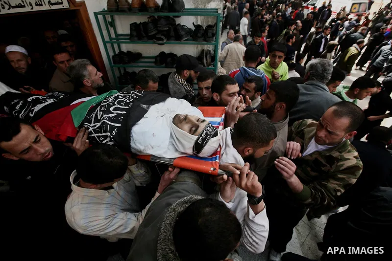Palestinians carry the body of Ahmed Salim during his funeral in Gaza Strip Sunday, March 11, 2012. The worst round of violence in more than a year between Israel and Gaza Strip Palestinians deepened Sunday with deadly I...