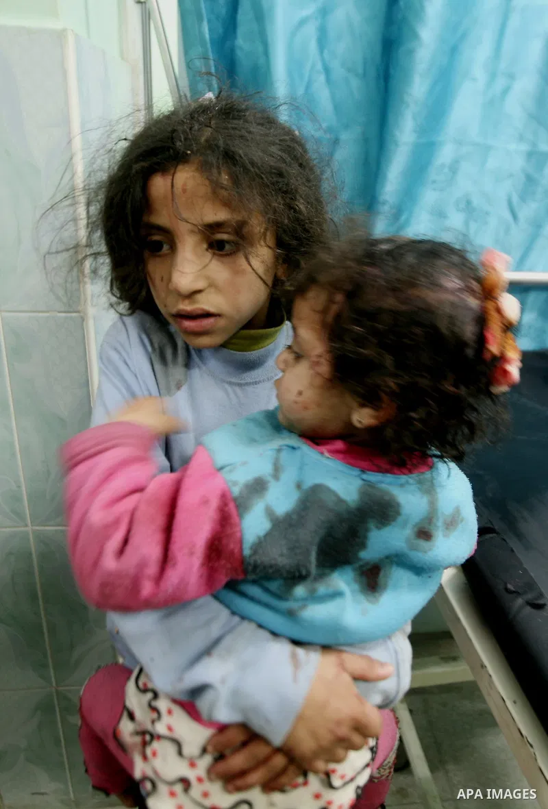 Wounded Palestinian children receive medical atttention at a hospital in Beit Lahia in the northern Gaza Strip on March 12, 2012, following an Israeli air raid. Israeli war planes carried out new air strikes on Gaza over...