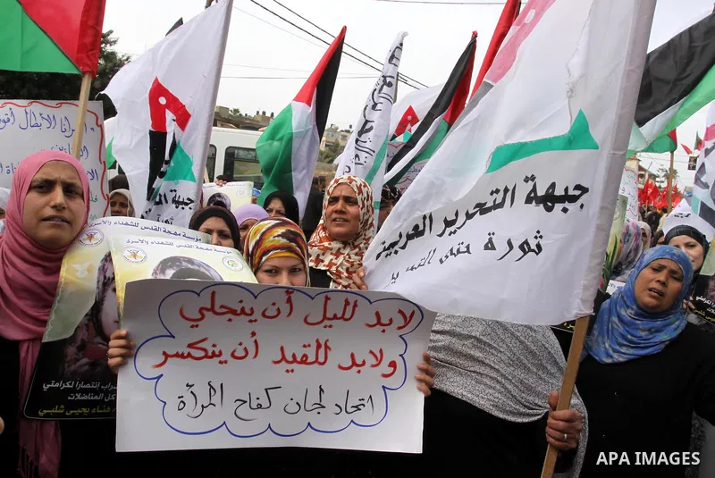 Palestinian women demonstrate in solidarity with Hana'a Shalabi during a protest in Gaza City, on Mar. 12, 2012. Shalabi, released by Israel in a prisoner swap last year but re-arrested earlier this month and held withou...