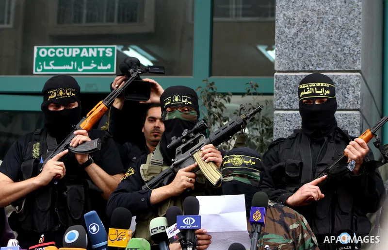 Islamic Jihad militants hold a news conference in Gaza City March 12, 2012. Israeli air strikes killed two Palestinian militants and a civilian in the Gaza Strip on Monday in a fourth day of cross-border hostilities, med...
