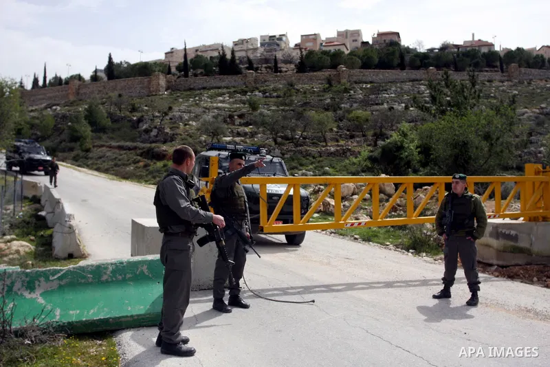 Israeli troops remove the ,Piet AXA, checkpoint near Ramot settlement, northern Jerusalem, March 12, 2012.. Photo by Issam Rimawi