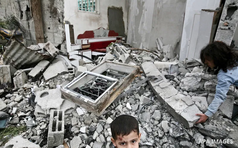 A Palestinian children in the rubble of a destroyed building following an Israeli air strike in the east of Jabaliya refugee camp on, 12 March 2012. Reports state that an Israeli air strike on the northern Gaza Strip's J...