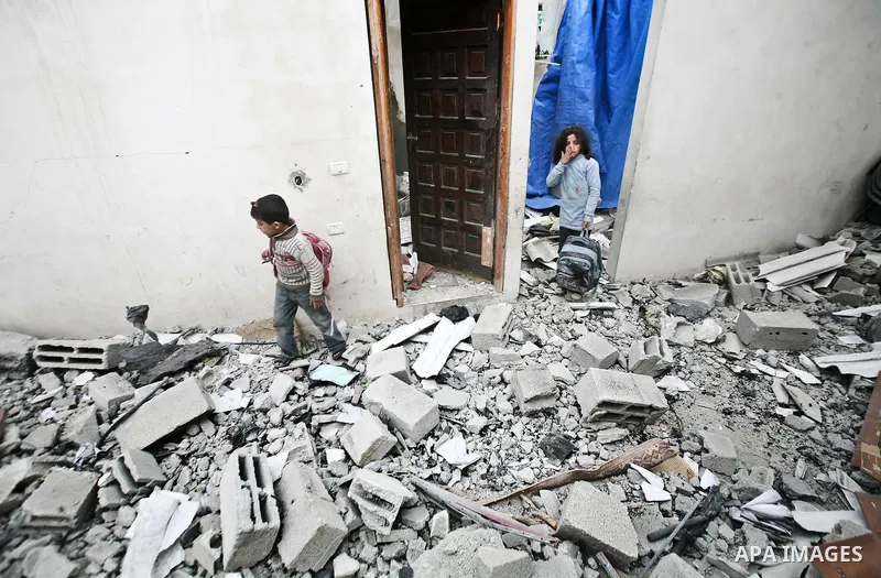 A Palestinian children in the rubble of a destroyed building following an Israeli air strike in the east of Jabaliya refugee camp on, 12 March 2012. Reports state that an Israeli air strike on the northern Gaza Strip's J...