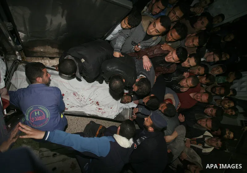 One of two Islamic Jihad militants who were killed in an Israeli airstrike on March 12, 2012 is transported into the morgue of Al-Shifa Hospital in Gaza city, as Israeli warplanes pounded Gaza for a fourth day, killing s...