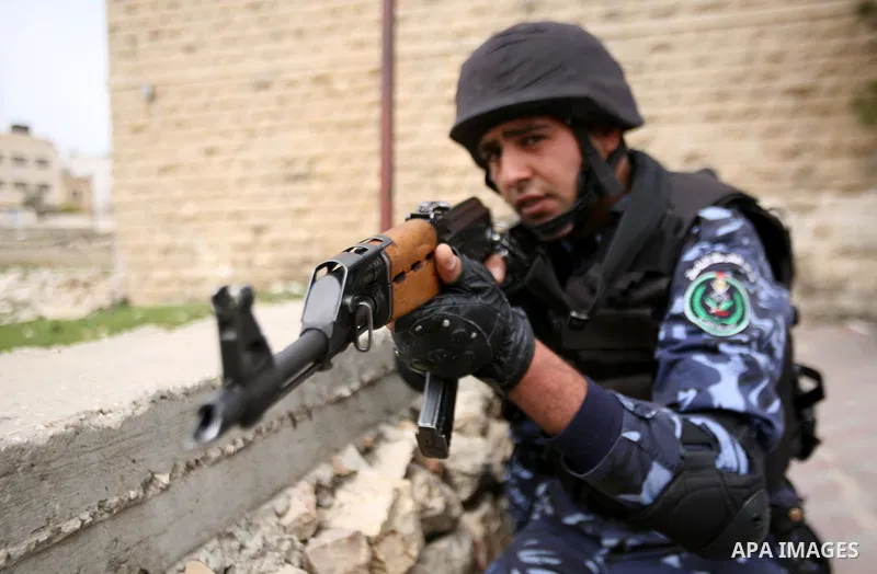Members of the Palestinian security forces take position during a training drill in the West Bank city of Hebron March 12, 2012. Photo by Mamoun Wazwaz