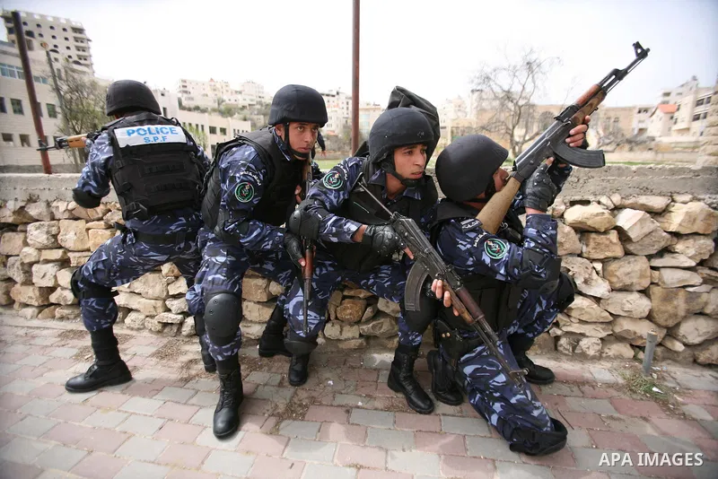 Members of the Palestinian security forces take position during a training drill in the West Bank city of Hebron March 12, 2012. Photo by Mamoun Wazwaz