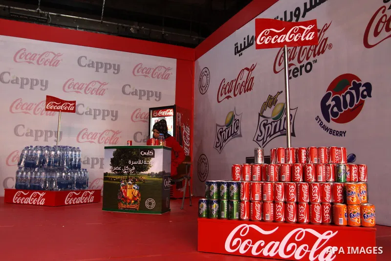 Palestinians attend exhibition for Palestinian food in Gaza City on Mar. 13, 2012. to support the Palestinian national products. Photo by Mohammed Asad