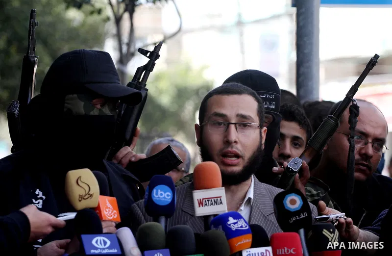 The spokesman for the Brigades al-Nasser Salah el dein, Khaled Al Azbat, speaks during press conference, in Gaza City, on Mar. 13, 2012. Photo by Mohammed Asad