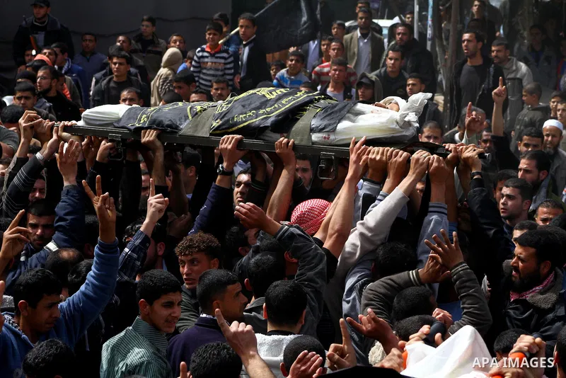 Palestinians carry the body of Islamic Jihad militant Mohammed Daher during his funeral in Gaza City March 13, 2012. An Egyptian-brokered truce between Israel and militant groups in the Gaza Strip began to take hold on T...
