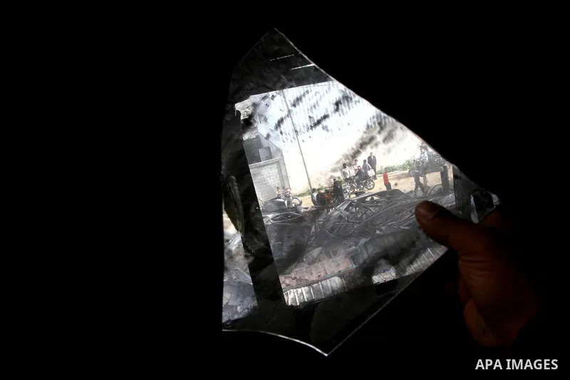 Palestinians inspect destroyed buildings on March 14, 2012, following an Israeli air strike on Gaza City. Israel and militants in Gaza began observing an Egyptian-brokered truce on March 13, after four days of violence,...
