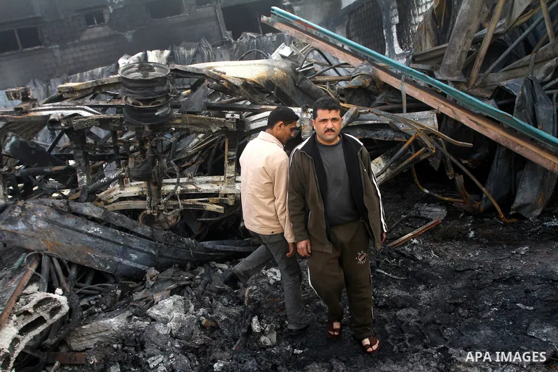 Palestinians inspect destroyed buildings on March 14, 2012, following an Israeli air strike on Gaza City. Israel and militants in Gaza began observing an Egyptian-brokered truce on March 13, after four days of violence,...