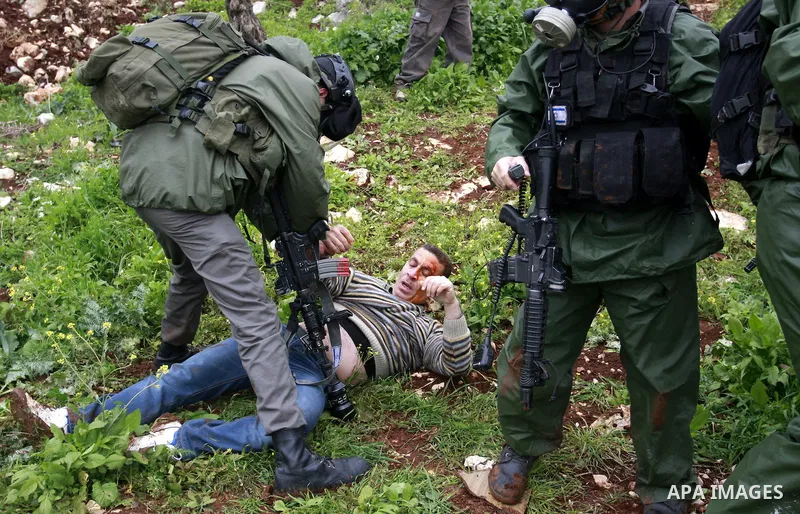 Israeli security forces arrest a palestinian ,during a protest in the village of Kufr Qaddum near the Israeli settlement of Kdumim, in the northern West Bank, Friday,March 16, 2012. Photo by Wagdi Eshtayah