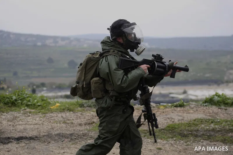 Israeli border police run towards Palestinian demonstrators, during a protest in the village of Kufr Qaddum near the Israeli settlement of Kdumim, in the northern West Bank, Friday,March 16, 2012. Photo by Wagdi Eshtayah