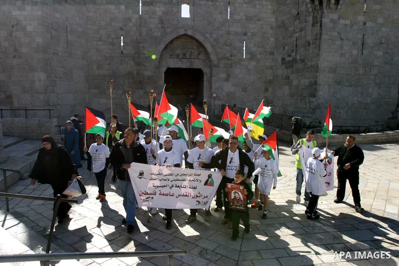 Marathon runners leave the Old City of Jerusalem during the Jerusalem Marathon, in Jerusalem, 19 March 2012. Photo by Mahfouz Abu Turk