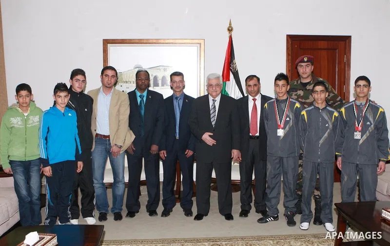Palestinian President, Mahmoud Abbas (Abu Mazen), meets with delegation of the federation of Taekwondo, in the West Bank city of Ramallah on March 19, 2012. Photo by Thaer Ganaim