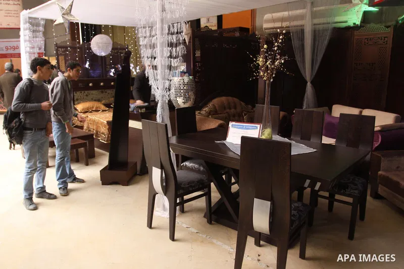 Palestinians attend exhibition for Palestinian wooden Furniture in Gaza City on Mar. 20, 2012. to support the Palestinian national industries. Photo by Mohammed Asad