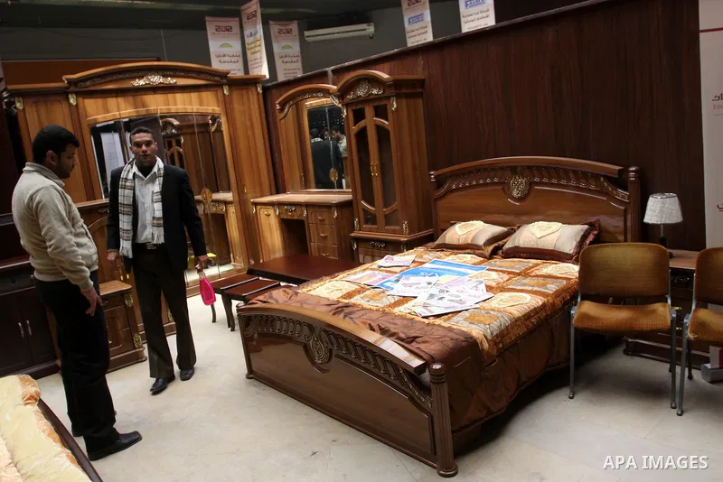 Palestinians attend exhibition for Palestinian wooden Furniture in Gaza City on Mar. 20, 2012. to support the Palestinian national industries. Photo by Mohammed Asad