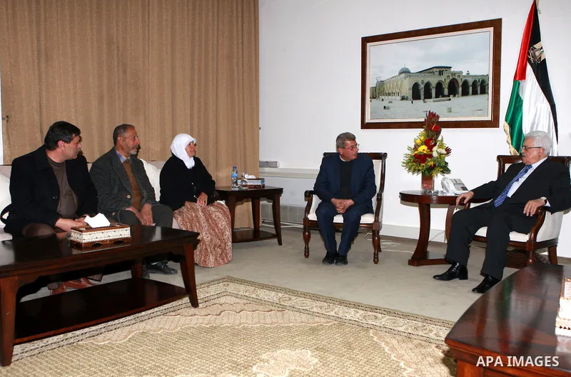 Palestinian President, Mahmoud Abbas (Abu Mazen), meets with the family of prisoner Hana Shalaby, in the West Bank city of Ramallah on March 20, 2012. Photo by Thaer Ganaim