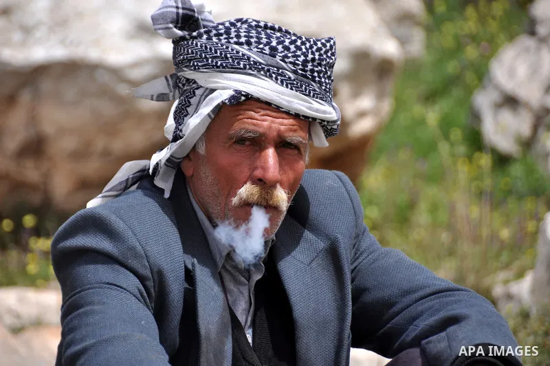Palestinian shephered Abu Jaafar smokes in Biet Leed village near the west bank city of Tulkarem, 20 March 2012. Photo by Nedal Eshtayah