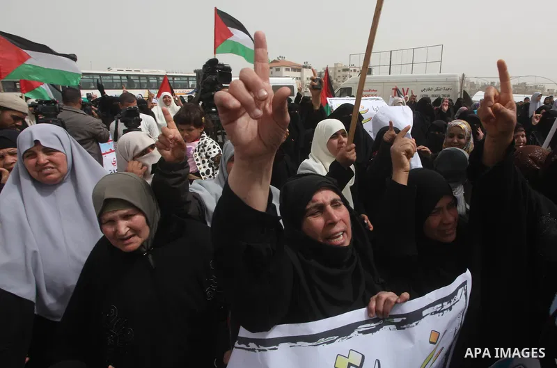 Palestinian women take part in a Hamas rally calling on Egyptian authorities to provide the Gaza Strip with electricity and fuel near the Rafah Border crossing, in the southern Gaza Strip, 20 March 2012. Gazans are repor...