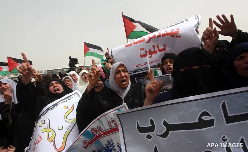 Palestinian women take part in a Hamas rally calling on Egyptian authorities to provide the Gaza Strip with electricity and fuel near the Rafah Border crossing, in the southern Gaza Strip, 20 March 2012. Gazans are repor...
